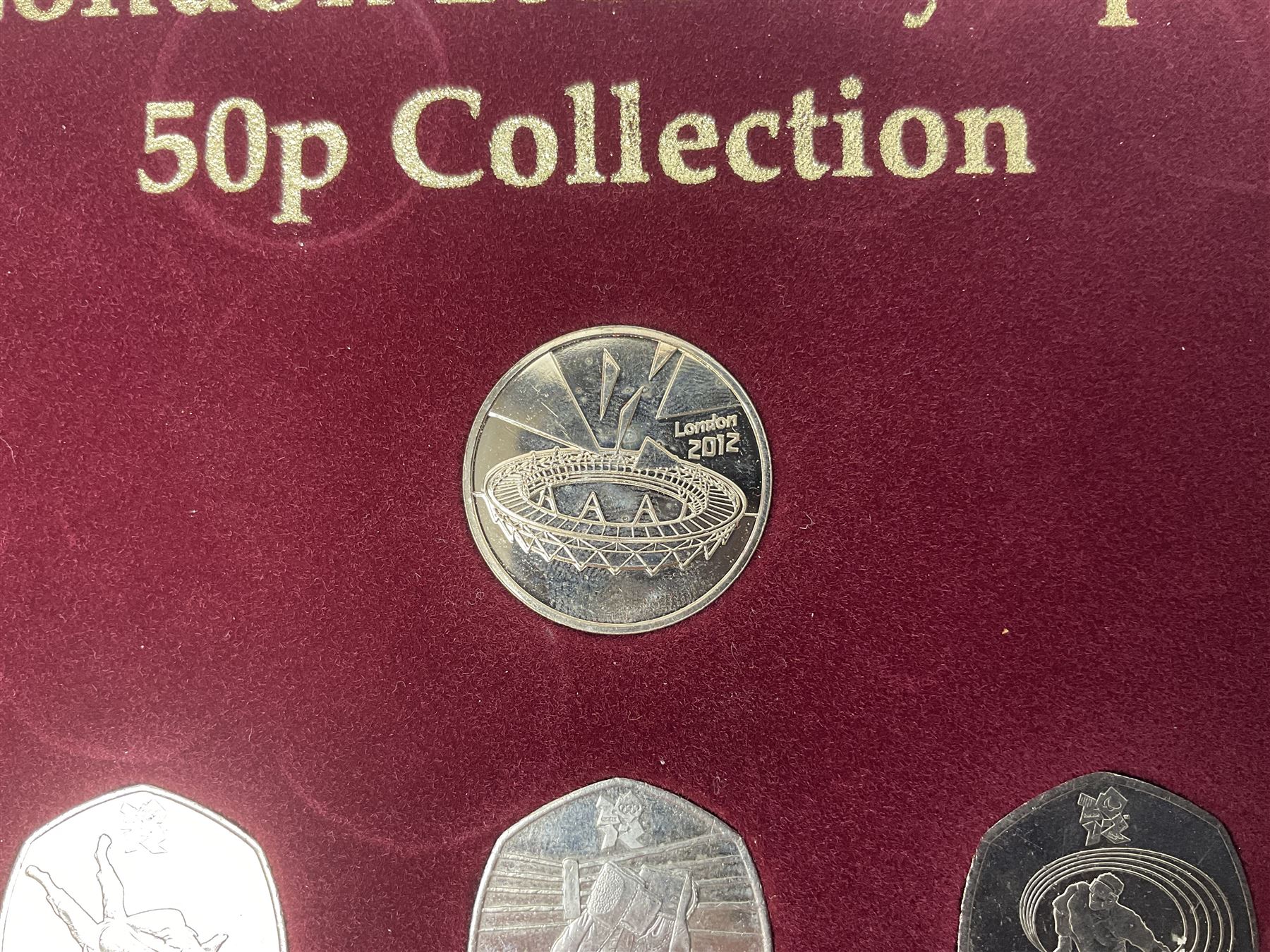 Queen Elizabeth II United Kingdom London 2012 Olympic commemorative fifty pence collection comprising twenty-nine coins and completer medallion, housed in unofficial display case