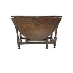 19th century country oak drop leaf dining table, oval top over turned gate-leg supports united by stretchers