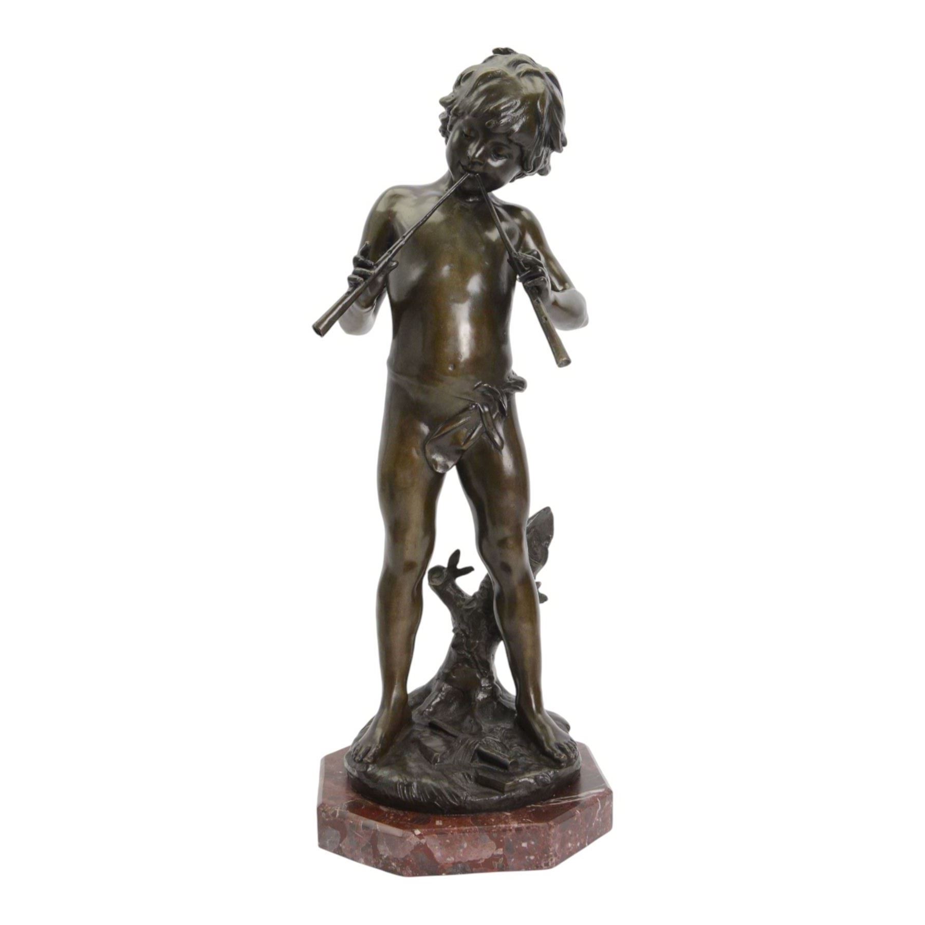 After Auguste Moreau (French 1834-1917): Large Bronze Figure of a Young Boy Playing the Aulos (Double-Reeded Pipes) standing upon a naturalistically modelled base detailed with tree stump and further pipe, signed Aug Moreau, upon octagonal red marble base, H73cm