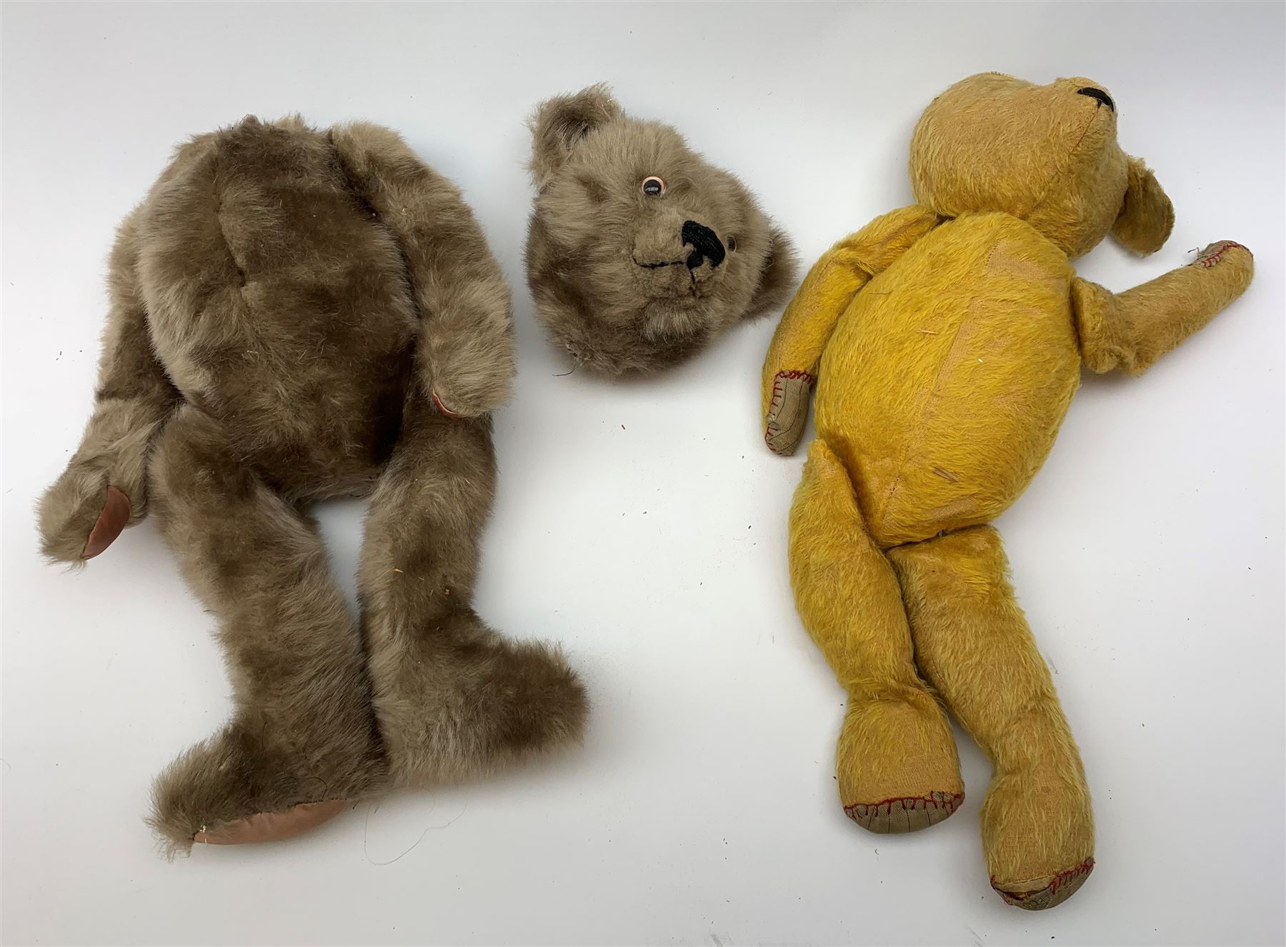 Quantity of early wood wool filled teddy bears for restoration.