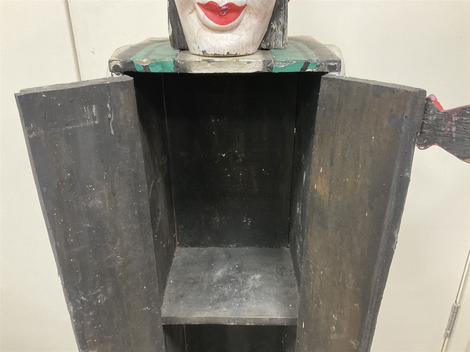 Folk art circus clown cabinet, the the two hinged doors with bow tie decoration opening to reveal fitted shelved interior, the body painted with polka dots and spades, H121cm