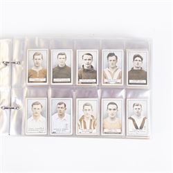 Collection of Edwardian and later Football related trading and cigarette cards, including forty-nine of fifty 1906 Ogden's Football Club Colours, 1922 PALS Footall series, ninety of one hundred 1925 Gallaher Famous Footballers, complete set of forty-four 1926 Ogden's Captains of Association Football Clubs and Colours, complete set of fifty 1927 Players Football Caricatures by MAC,  complete set of fifty 1927 Players Football Caricatures by RIP,  complete set of fifty 1930 Players Association Cup Winners, complete set of 50 1933 Ogdens AFC Nicknames etc, housed in brown cigarette card album