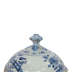 Late 18th/early 19th century Chinese export blue and white tureen and cover, the body with twin curved handles, the pieced and domed cover with multi flower head finial, painted with peonies, rockwork, and fences, overall H26.5cm D22cn 