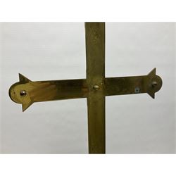 Brass alter cross, decorated with glass cabochons, upon a acicular stepped base and three claw feet, H73cm 