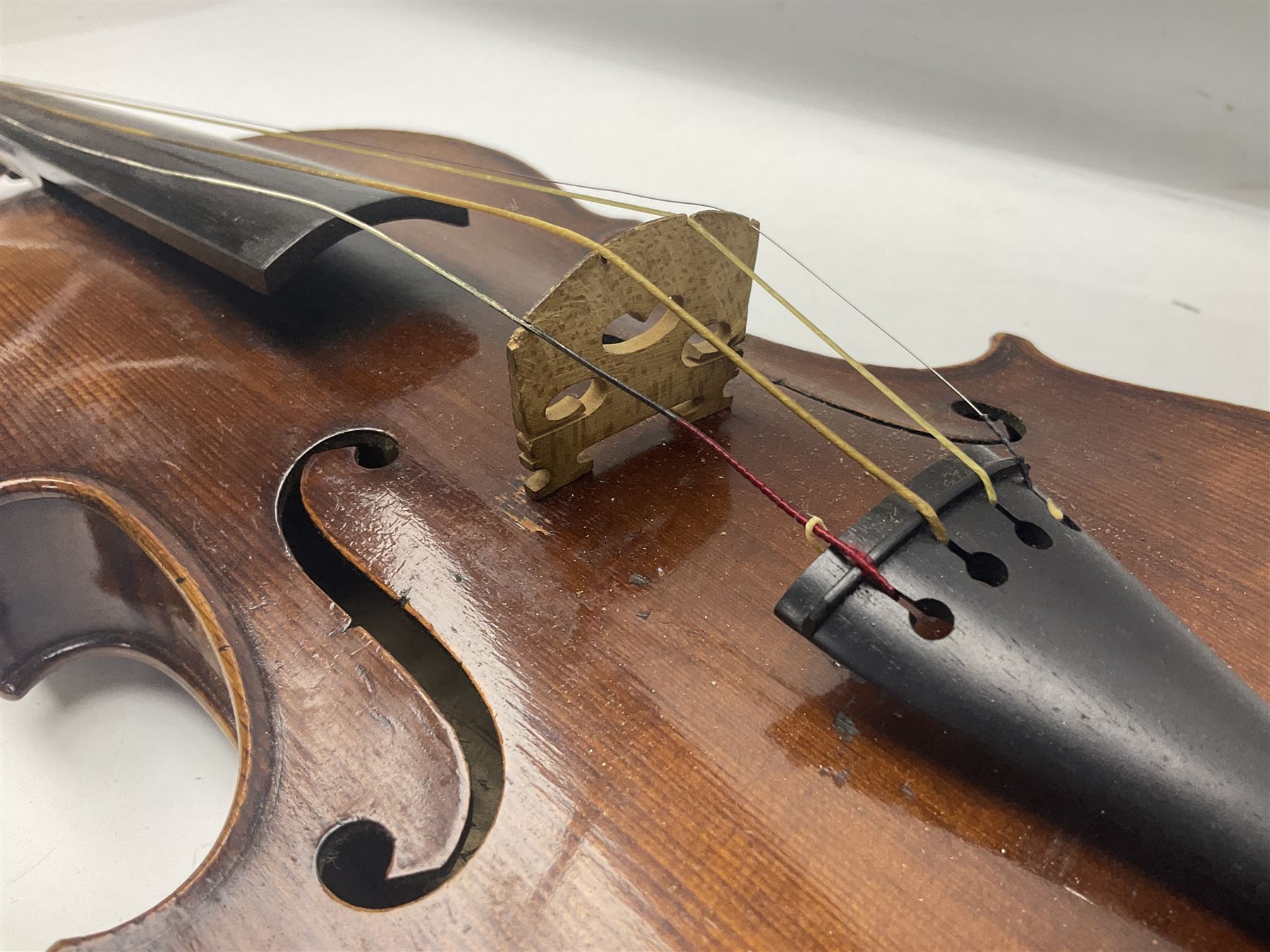 German trade violin c1900 with 35.5cm two-piece maple back and spruce top; bears label 'Made in Germany Apollo Class 6 No.2132' L59cm; in carrying case with two bows