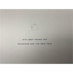 HM Queen Elizabeth II and HRH The Duke of Edinburgh - signed 1956 Christmas card with gilt embossed crown to cover, black and white photograph of the smiling Royal Couple with Prince Charles and Princess Anne on board Britannia, signed in ink 'Philip 1956 Elizabeth R',