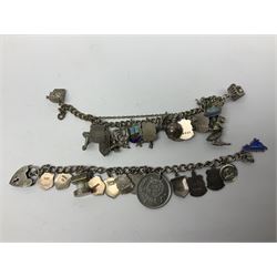 Four charm bracelets, with charms including animals and enamel country and towns, scarecrow, gun and some silver examples