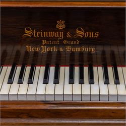 Steinway & Son, New York & Hamburg- Model B, overstrung Drawing Room Grand Piano in a rosewood case, Serial No 87297 (1896/7), with 85 ivory covered and ebony keys A0-A7(7 octaves) with an adjustable fretted music desk, brass fittings and pedals, Steinway “Fireplug” straight columnar and fluted legs with roller castors and conforming lyre, duplex stringing with agraffs, bass strings copper wound with a steel core, steel tuning pins, original Steinway action, hammers, keys, felts, and dampers, with una-corda, sostenuto and sustain pedals, Overstrung iron frame detailing numerous Steinway patents, awards, and features. Tuned to Concert pitch (A=440). 
With an adjustable single stool. 

This item has been registered for sale under Section 10 of the APHA Ivory Act HLB1KY67