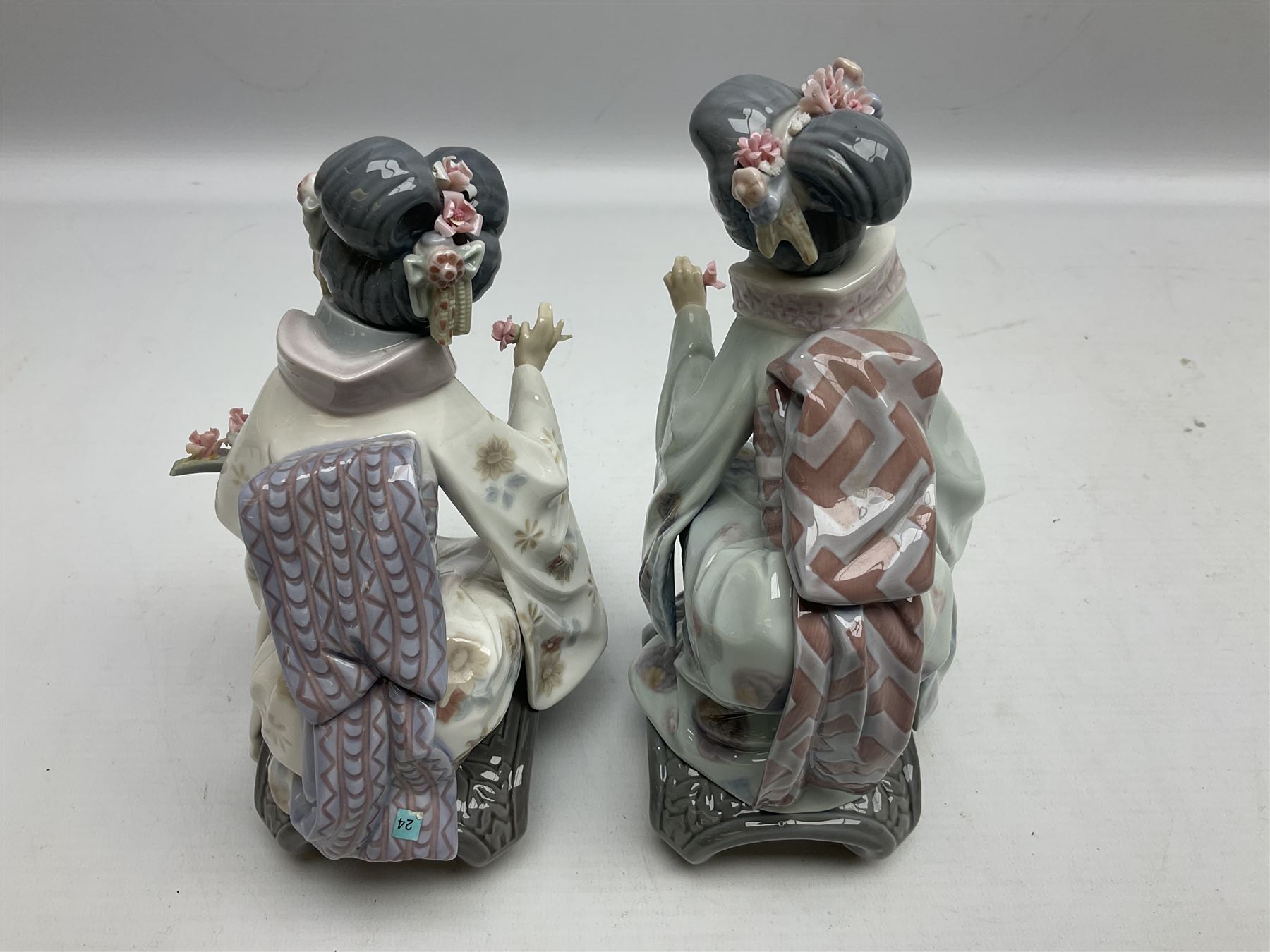 Two Lladro Japanese Ladies figures, comprising Kiyoko no 1450 and Yuki no 1448, both issued 1983, retired 1998, largest example H20cm