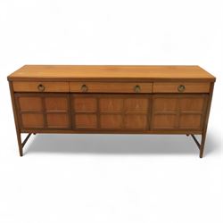 Nathan - mid 20th century teak sideboard, fitted with three drawers with brass ring handles, above a central fall front cabinet, flanked by two cupboard doors, raised on square tapering supports