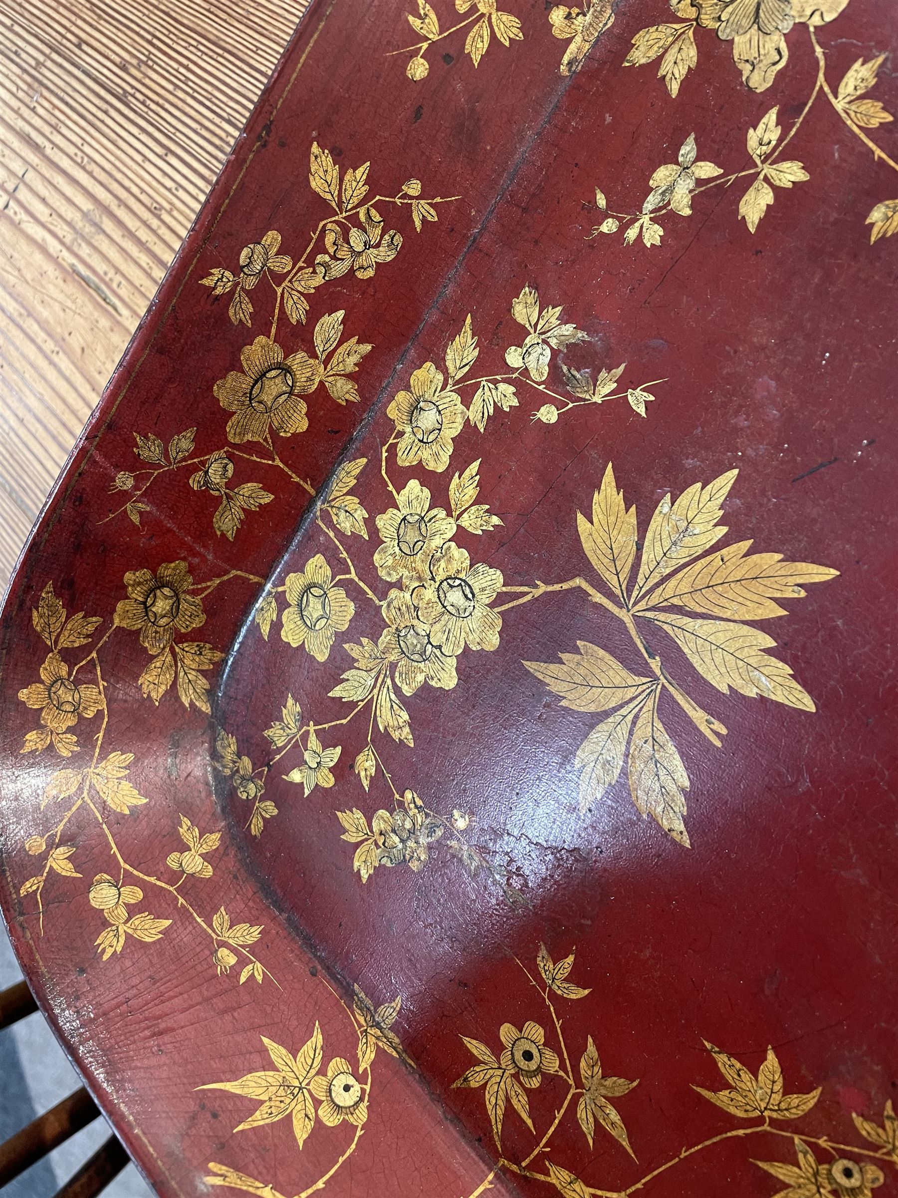 Early 19th century red lacquered papier-mâché tray by Clay of King Street Covent Garden, of rounded rectangular form, painted in gilt with large foliate sprays and butterflies, impressed verso CLAY KING ST COVENT GARDEN, W66.5cm D48.5cm