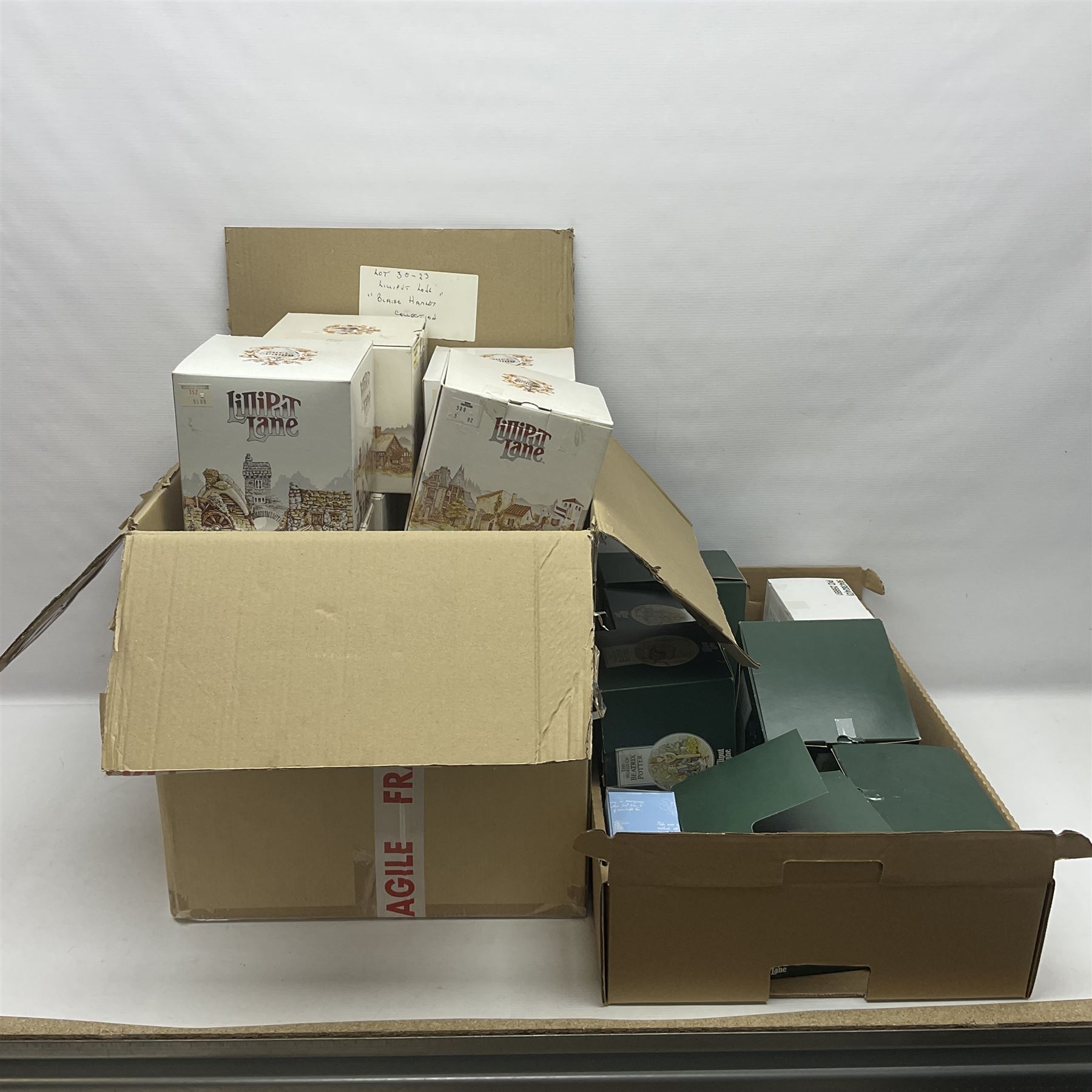 Eight Lilliput Lane limited edition Beatrix Potter models, including Buckle Yeat, Tabitha Twitchits Shop and Ginger Pickles Shop, together with twelve Lilliput Lane models from the Blaise Hamlet collection, including Dial Cottage, Diamond Cottage and Vine Cottage, all with deeds and original boxes (20)