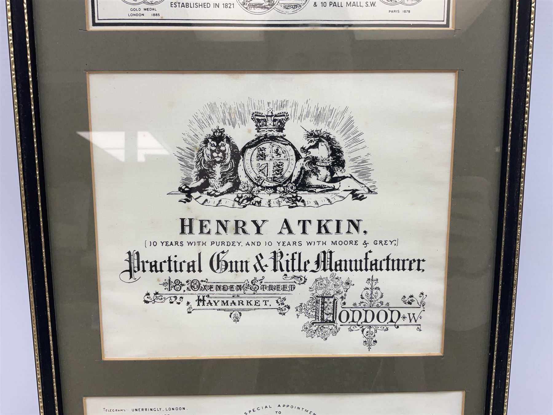Framed display of three trade gun case labels for Joseph Lang & Son, Henry Atkin and Stephen Grant & Sons, mounted in Hogarth style frame 56 x 25cm