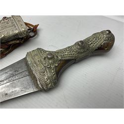 Saudi Arabian khanjar dagger with 29.5cm curving double edged  steel blade; white metal and copper mounted horn grip; in white metal mounted brass and leather scabbard incorporating embroidered leather wearing strap