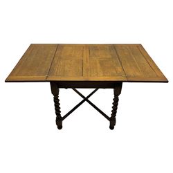 Early 20th century oak barley twist extending table, two fold-over leaves with pull-out stays, spiral turned supports joined by x-stretchers