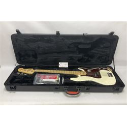 Fender Precision Bass guitar, in Olympic White finish with tortoiseshell effect scratchboard, serial no US15103092, in black Fender hard case with Fender strap and warranty card, guitar L116cm