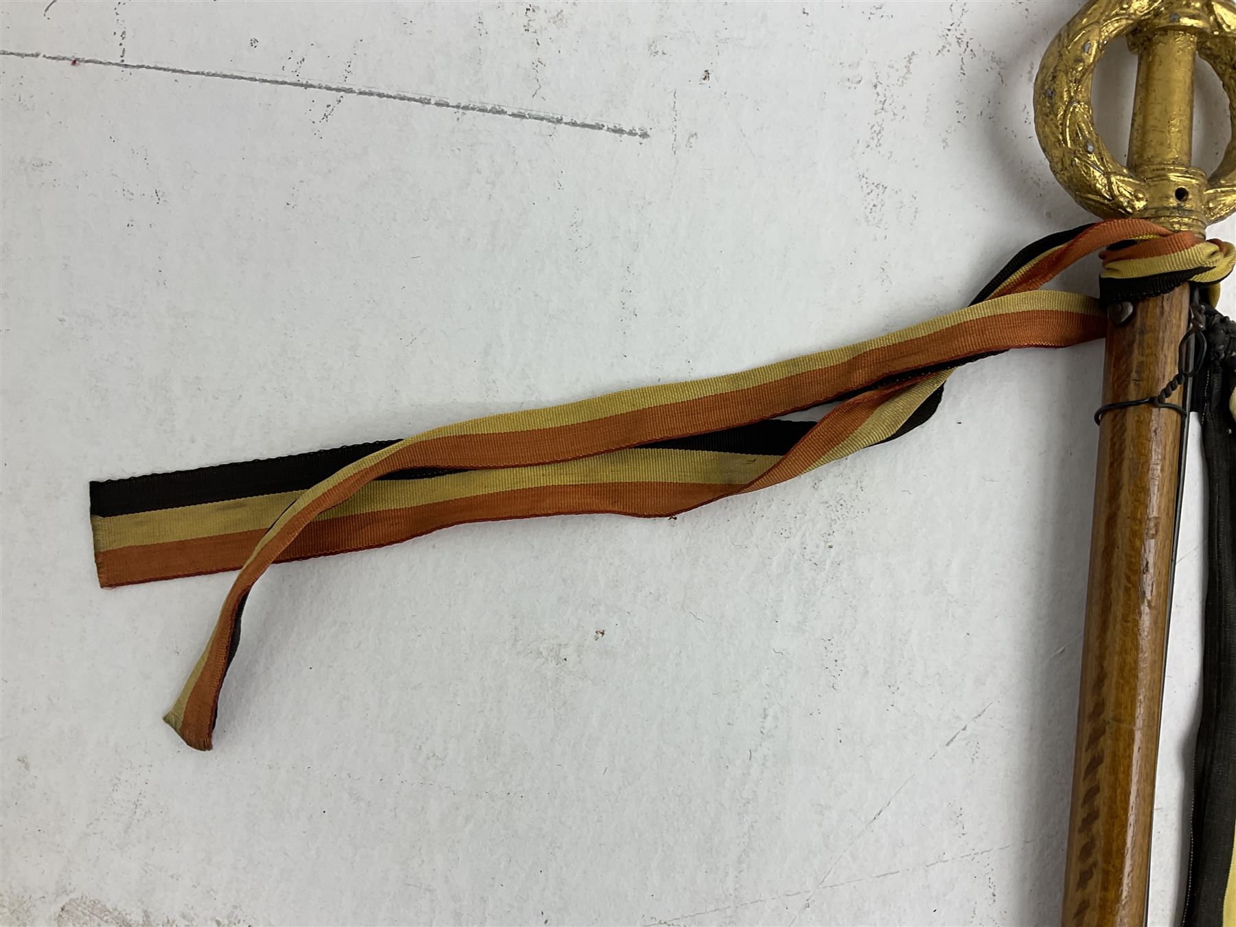 WW2 Belgian Partisan/Resistance two-sided banner embroidered in black on a cream ground 'Belgische Partisanen Korps 032 afd: Ph: De Bruyne' within a Belgian flag border; on wooden pole with gilded metal lion and laurel wreath finial