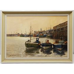 Don Micklethwaite (British 1936-): West Pier Scarborough, oil on canvas signed 45cm x 65cm