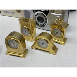 Kundo quartz clock, miniature brass clocks, two barometers, Sony digital camera, Nokia phone, Monarch Remington typewriter, commemorative Shilling etc