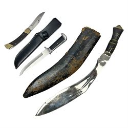Indian large kukri with 39cm curving blade and horn grip; in leather covered scabbard L51cm overall; an 'Original Bowie Knife', the 15cm stainless steel blade decorated with bison; in black sheath; and a brass and hardwood folding knife with two blades (3)