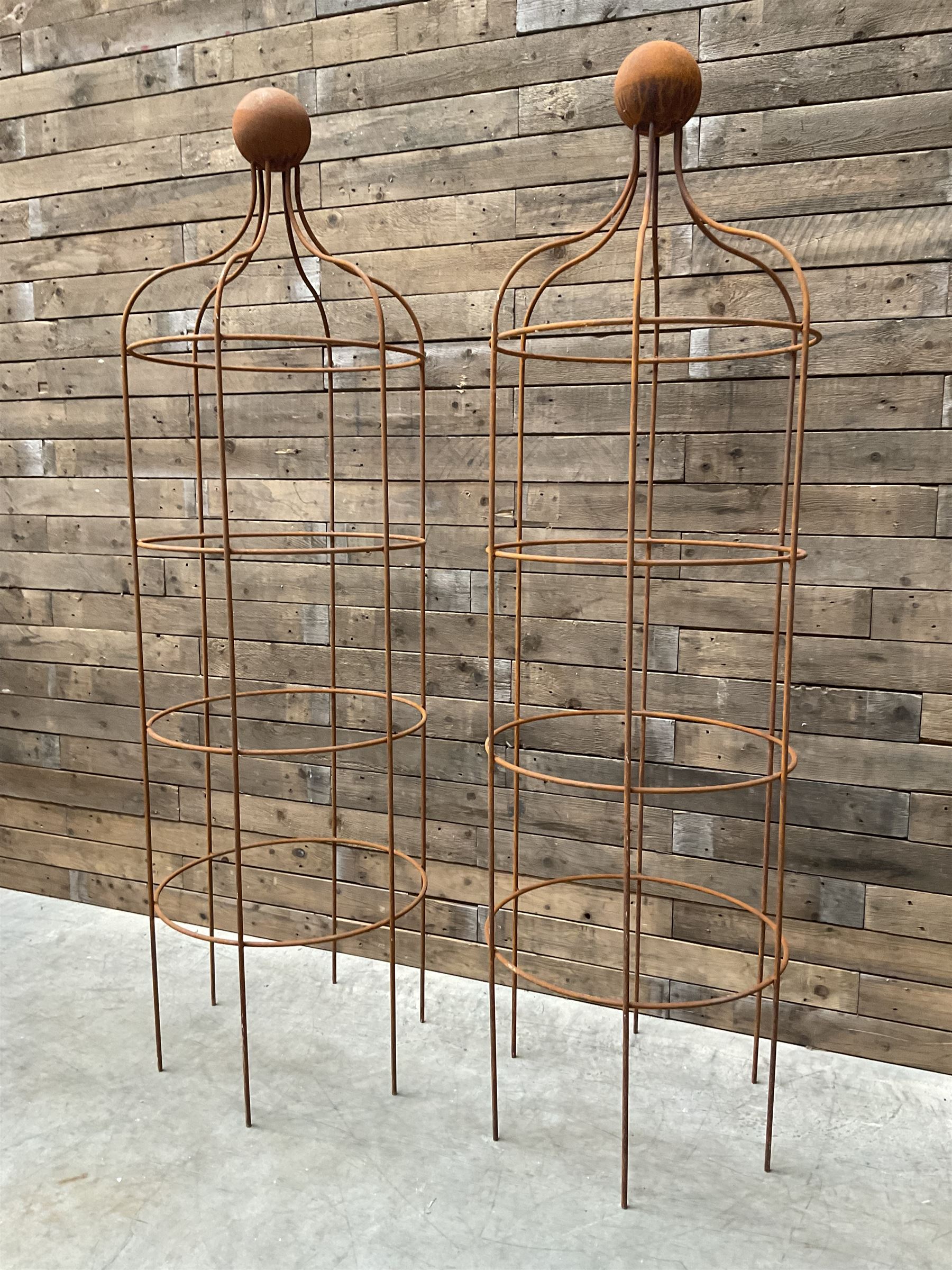 Pair of Country House wrought iron garden obelisks with ball finial, raise in four tiers