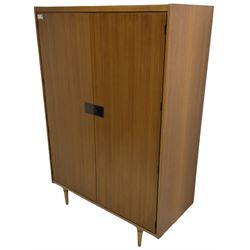 Wrighton - mid-20th century teak wardrobe, two doors enclosing hanging rail, shelves and hinged compartments, on turned tapering feet