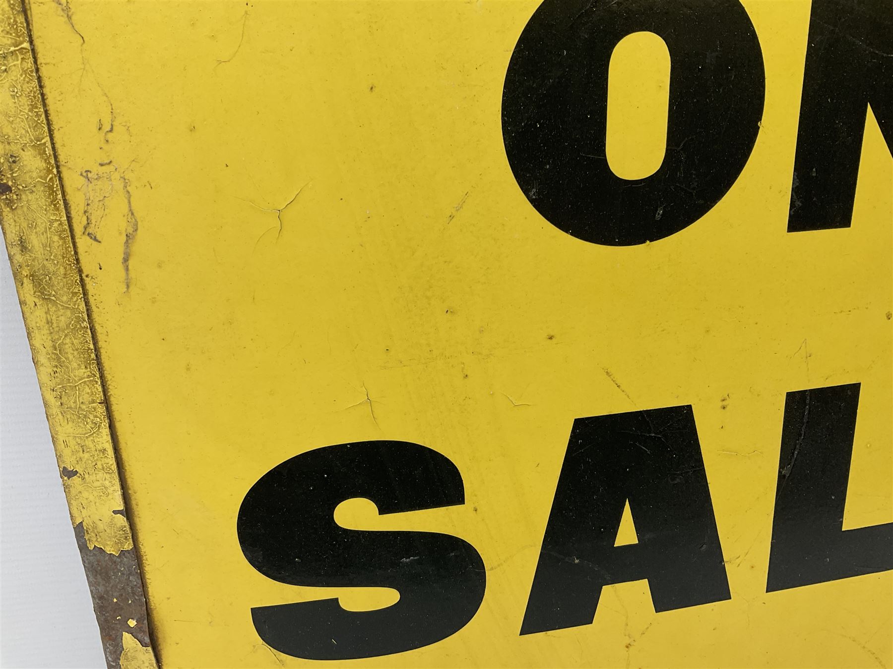 Enamel street advertising sign for The Manchester Guardian, with black lettering on yellow ground, H79cm W52cm