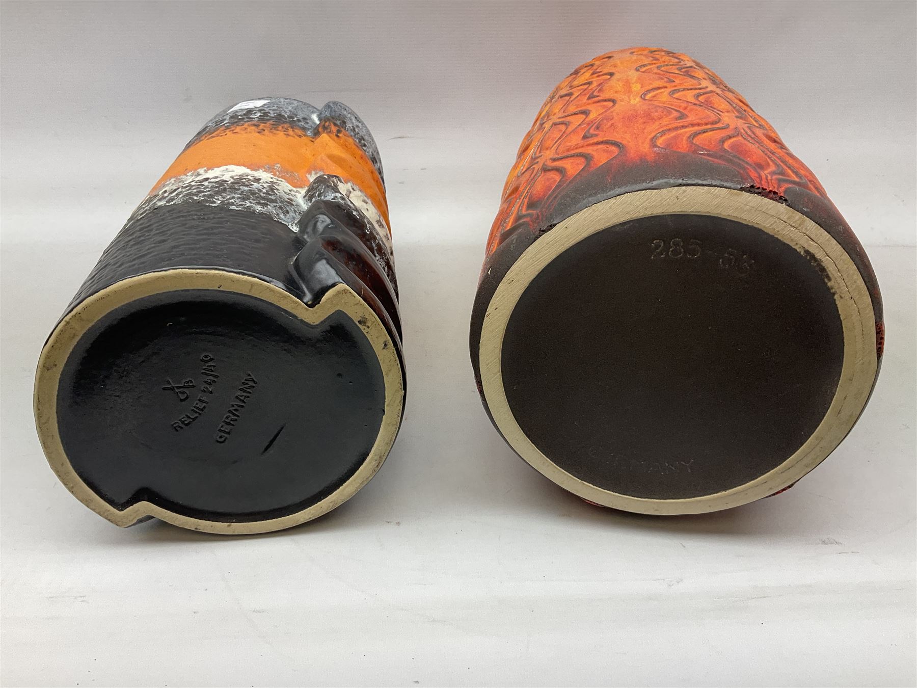 Two large West Germany pottery vases of cylindrical form with black and orange moulded decoration, with impressed marks beneath, largest H