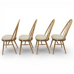 Ercol - elm dining chairs, set of six including two armchairs, arched spindle backs over shaped elm seats with upholstered pads, tapering beech legs joined by stretchers