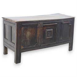 17th century oak blanket chest, panelled throughout with a paper lined interior on stile supports