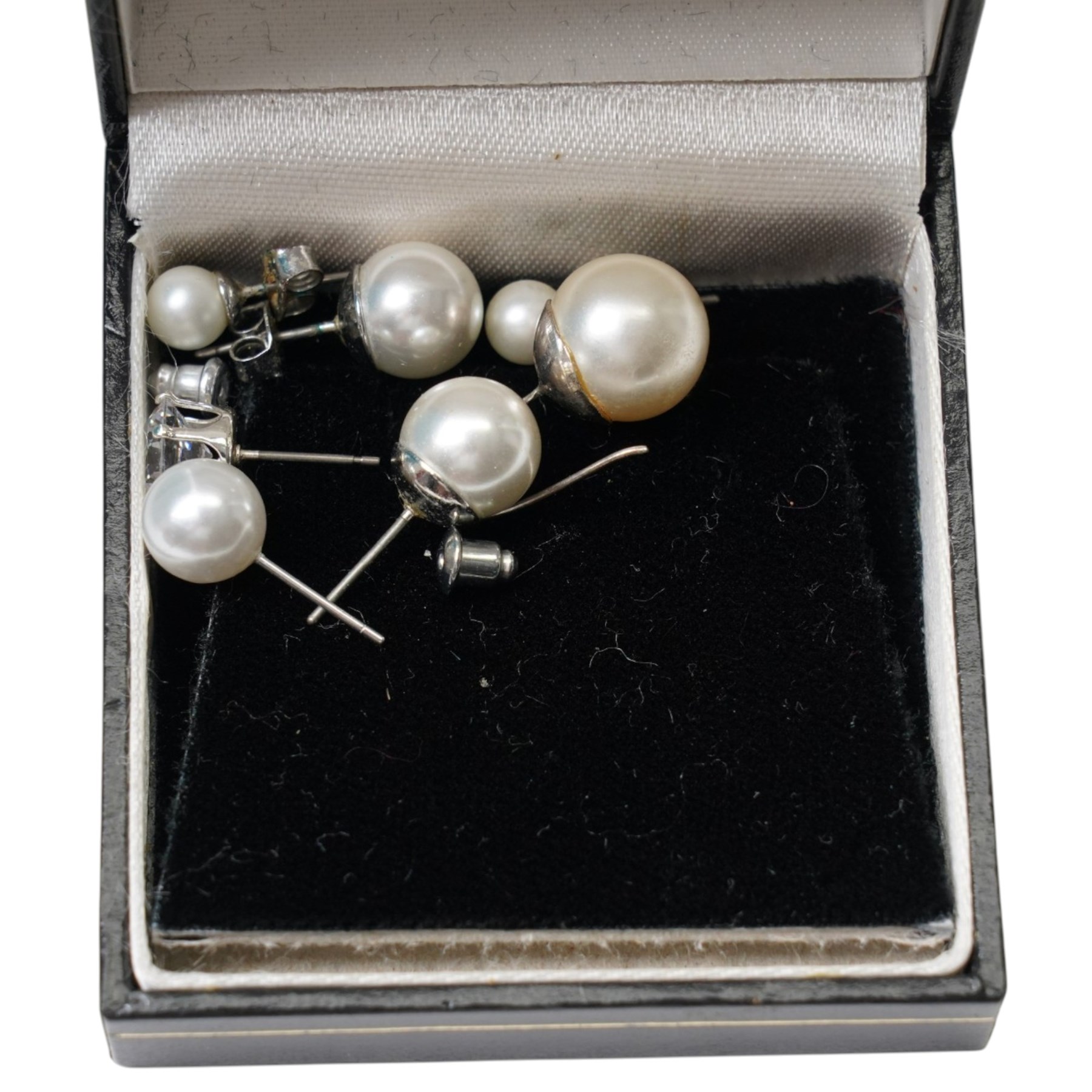 Two silver hinged bangles, 9ct gold mounted shell carved cameo brooch, badges, beaded necklaces etc