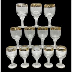 Set of twelve Moser style wine glasses, the bowls with etched floral bodies and gold banded rim with foliate decoration raised upon stem of twisted form, H14cm