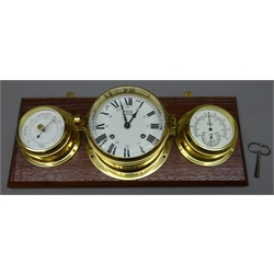 Ship's brass cased bulkhead clock, the dial inscribed FCC Precision,  two-train movement with watch bell strike/silent facility, mounted on an oak board with matching barometer and thermometer, L44cm   