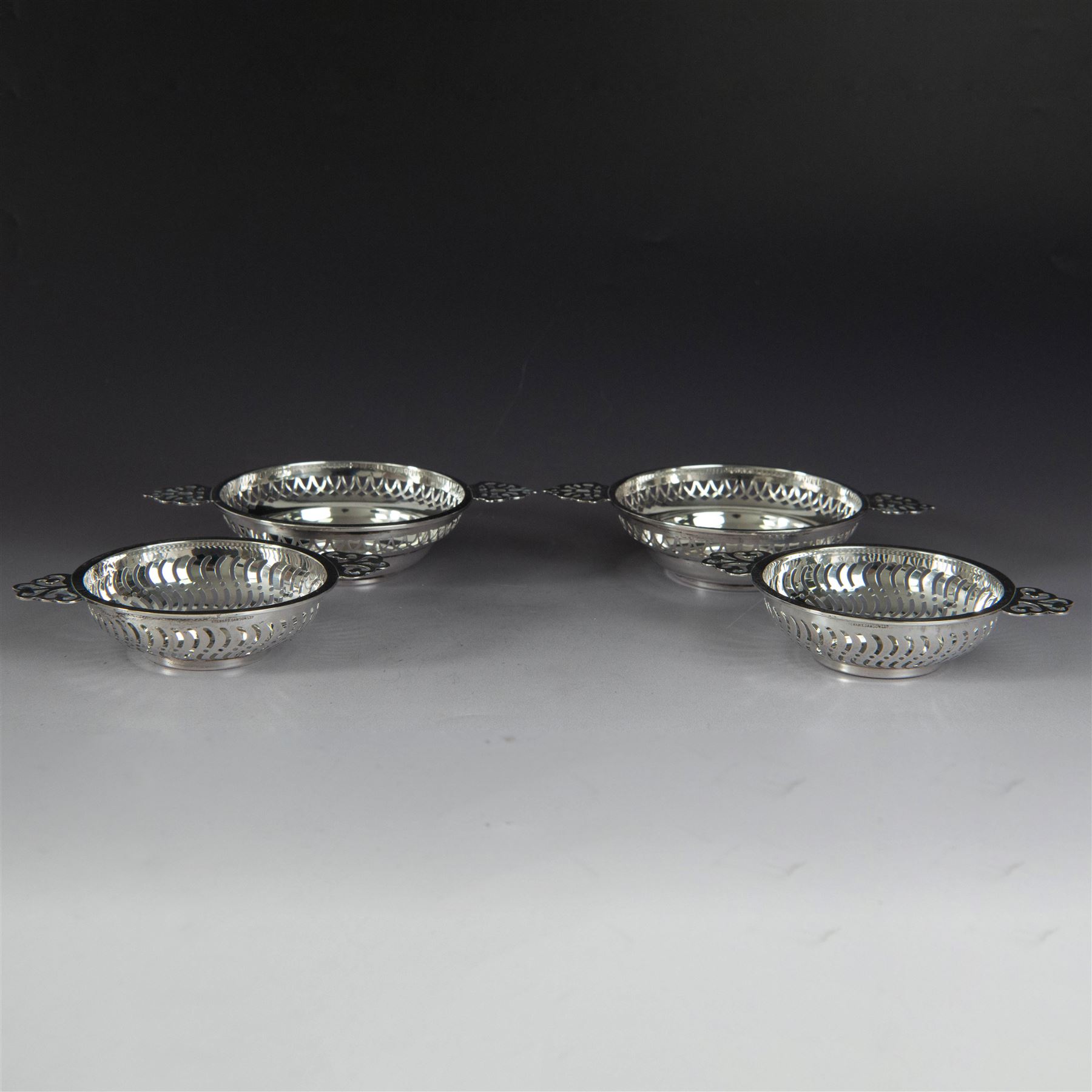 Two pairs of Victorian silver bon bon dishes, modelled as quaiches with pierced sides and twin handles, the larger pair hallmarked Synyer & Beddoes, Birmingham 1913 or 1938, the smaller pair hallmarked Birmingham 1913 or 1938, maker's marks worn and indistinct, largest D9cm