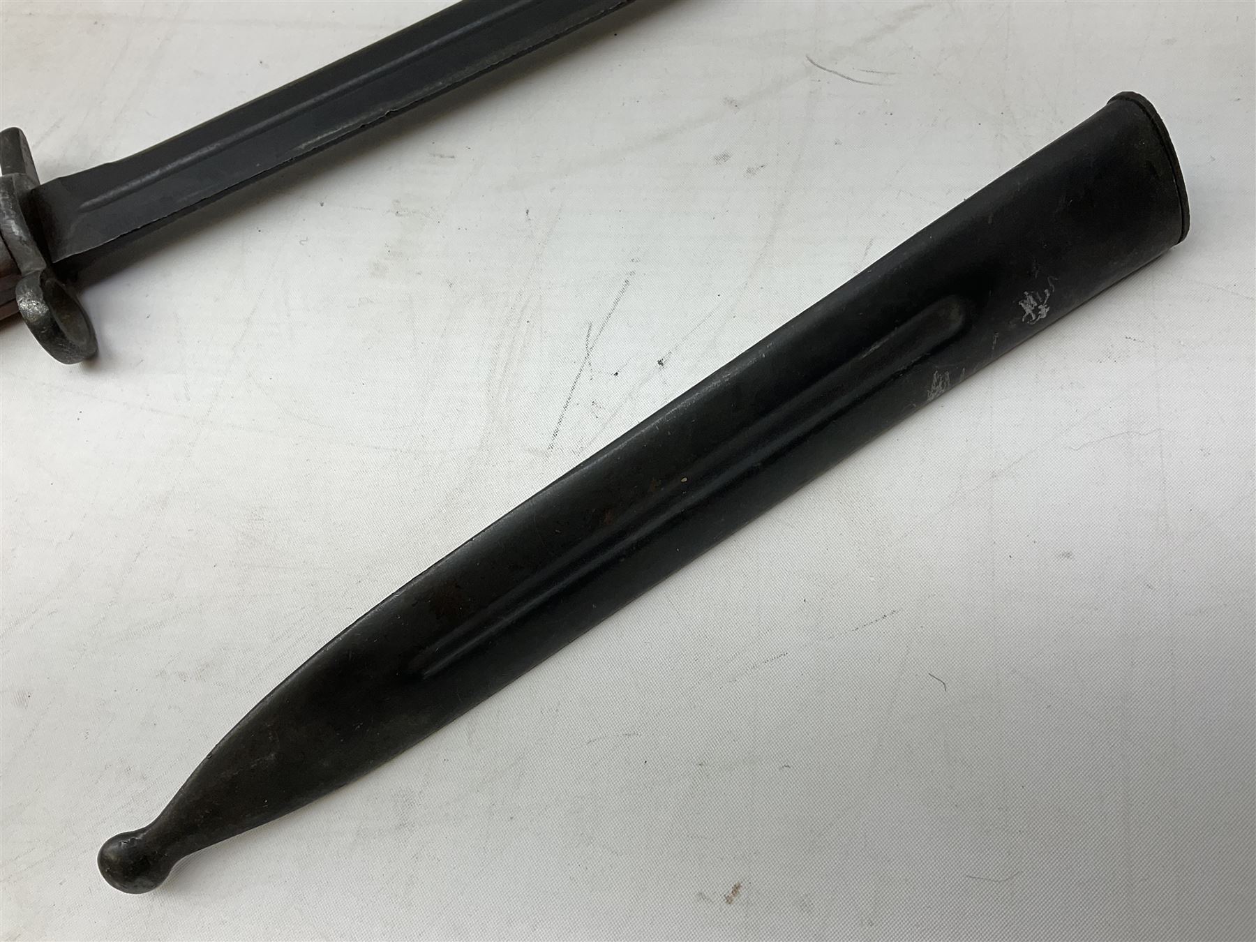 Swiss Model 1957 SIG rifle bayonet by Wenger with 23.5cm steel blade numbered 350857; in plastic scabbard with leather frog stamped GSCH 85 L38cm overall; and Egyptian Hakim rifle bayonet with the same script number to the grip and steel scabbard (2)