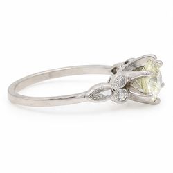 Platinum diamond ring, six claw set with a single old cut diamond of approx 1.35 carat, each shoulder milgrain set with two single cut diamonds and a marquise cut diamond, stamped Plat