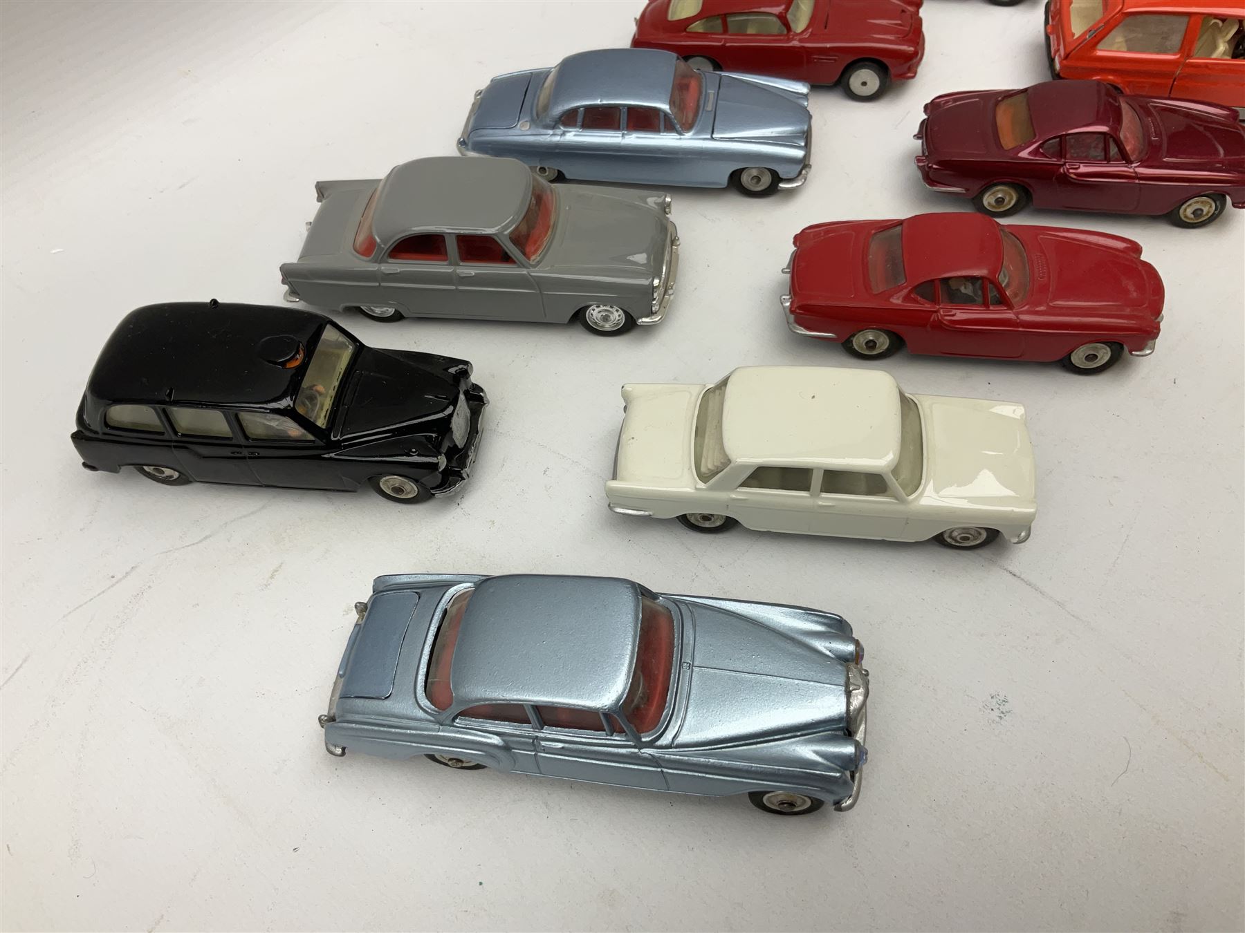 Corgi - thirty unboxed and playworn/repainted die-cast cars including Triumph Herald Coupe, BMC Mini-Cooper 'S', Porsche Carrera, two 'E' Type Jaguars, Rover 2000TC, three Morris Minors, two Aston Martin DB4, two Volvo P1800, MGA, Fiat 2100, Jaguar 2.4 Litre, Jaguar Mark X Saloon etc (30)