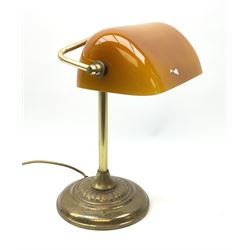 A brassed bankers lamp with spreading circular base and yellow glass shade, approximately H36cm. 