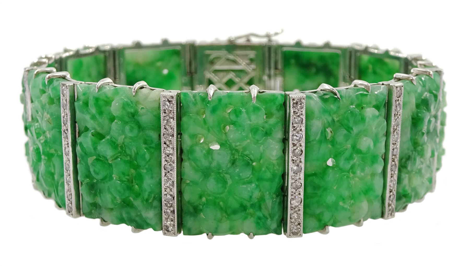 Art Deco platinum and white gold jadeite and diamond bracelet, twelve carved foliate jadeite panels, separated by a row of milgrain set old cut diamonds