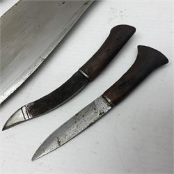 Kukri with curving blade, hardwood and brass grip in leather covered scabbard with two skinning knives, blade L33cm, overall 43cm
