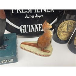 Collection of Guinness memorabilia, to include a ceramic wall plaque 'Guinness the free, the flow, the frothy freshener', pin badges, miniature bottles etc  
