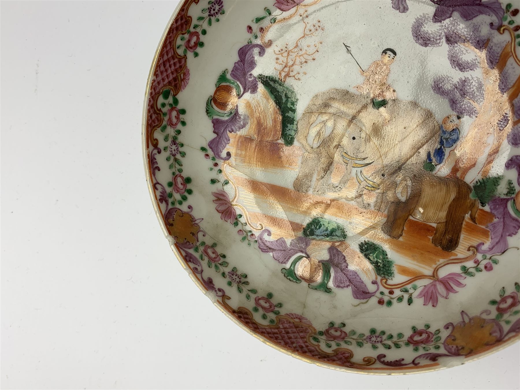 18th Century Chinese export tea bowl and saucer, decorated in the Famille Rose pallet with figures and elephants, tea bowl D8.5cm, saucer D13.5cm