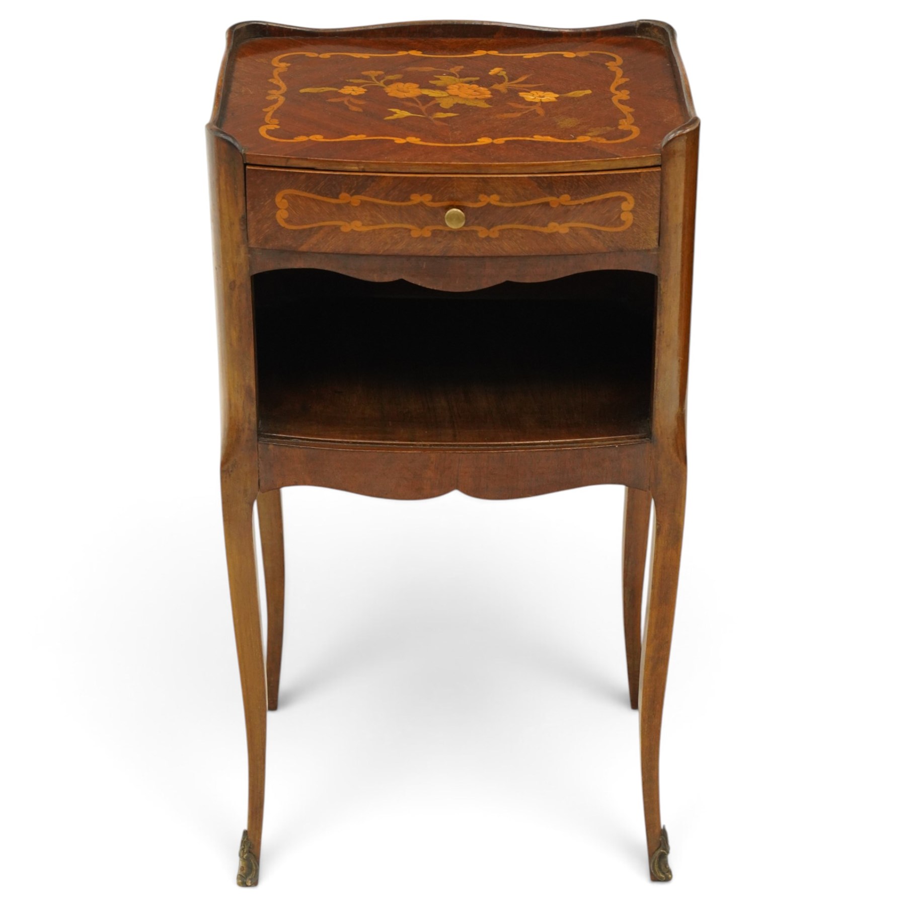 Matched pair of French inlaid floral marquetry bedsides, the three-quarter gallery tray top with central floral bouquet inlay and C-scroll border, one fitted with single frieze drawer over recessed cupboard and shaped apron, the other with three drawers, raised on tapering cabriole supports, with brass cartouche feet