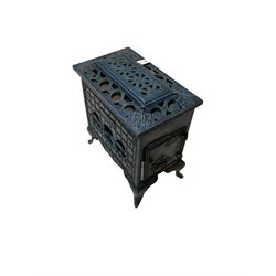 Poeles Nanquette - Art Deco 'Phebus' French enamel wood burning stove, indigo colour with pierced scrollwork decoration and acanthus leaves, on cabriole supports