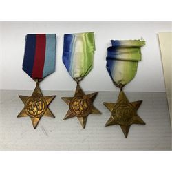 Twelve WW2 medals comprising four Atlantic Stars, three 1939-1945 Stars, three 1939-1945 War medals, Italy Star and Defence Medal with slip; together with two unrelated WW2 medal slips