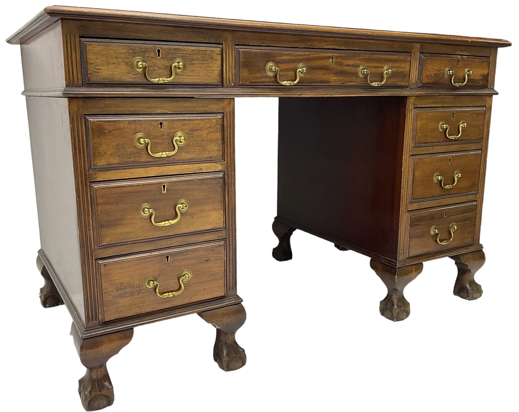 Early 20th century mahogany twin pedestal desk, fitted with nine drawers, on ball and claw carved cabriole feet