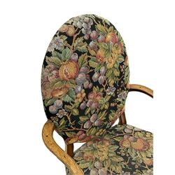 Pair of George III mahogany framed open armchairs, oval back and serpentine seat upholstered in fruit and foliage patterned fabric, shaped and moulded arms and arm supports, on square tapering moulded front supports 