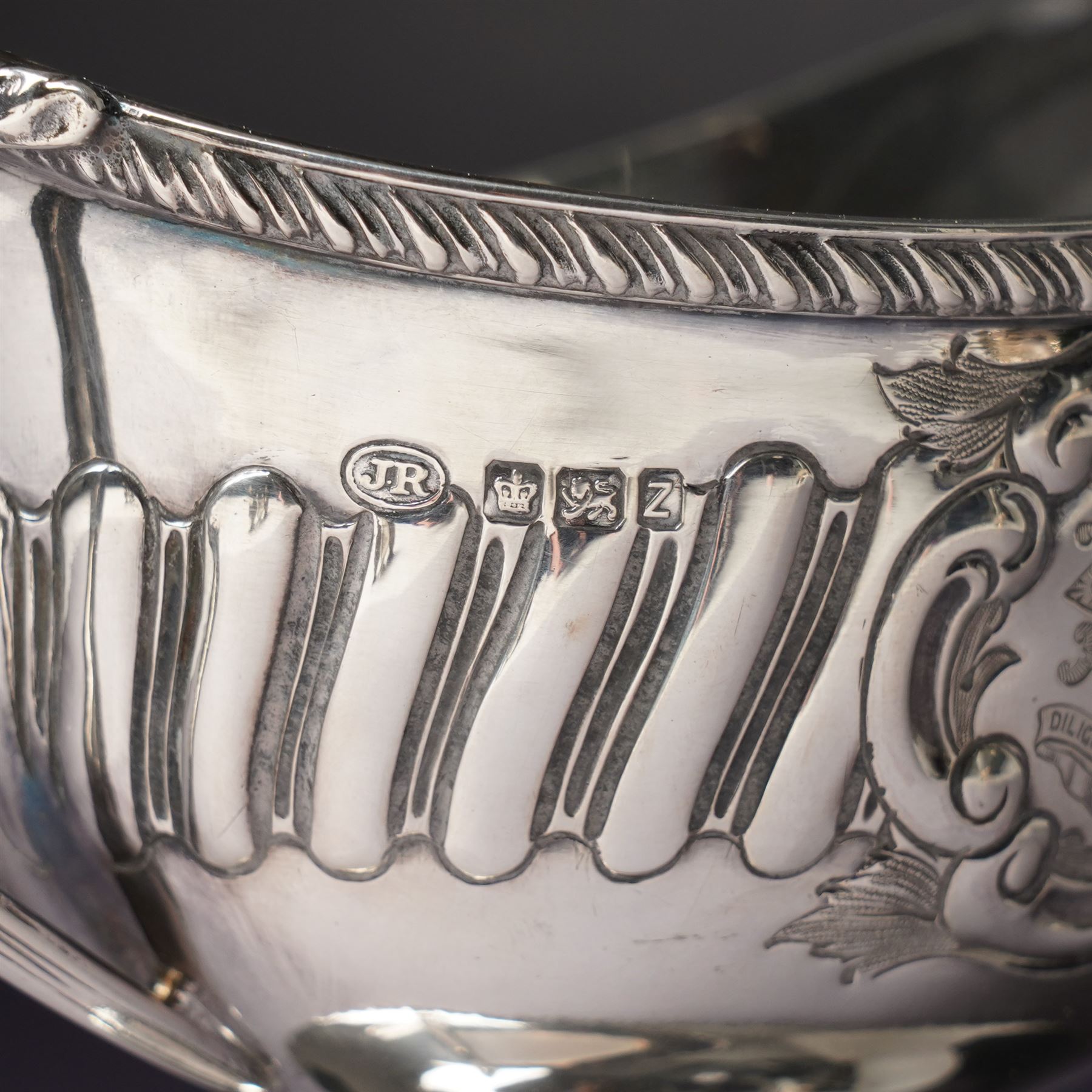Victorian silver sauce boat engraved with a monogram Sheffield 1892 Maker John Round  & Son Ltd, another with crimped rim Birmingham 1912 Maker Elkington & Co, two silver pepperettes and a small silver challenge cup