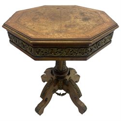 Mid-20th century figured walnut Italian design centre table, octagonal quarter veneered top with cross banding and moulded edge, the skirt decorated with scrolling foliage gilt metal mounts, on turned pedestal mounted with gilt acanthus leaves, quadruple splayed supports with further acanthus leaf decoration