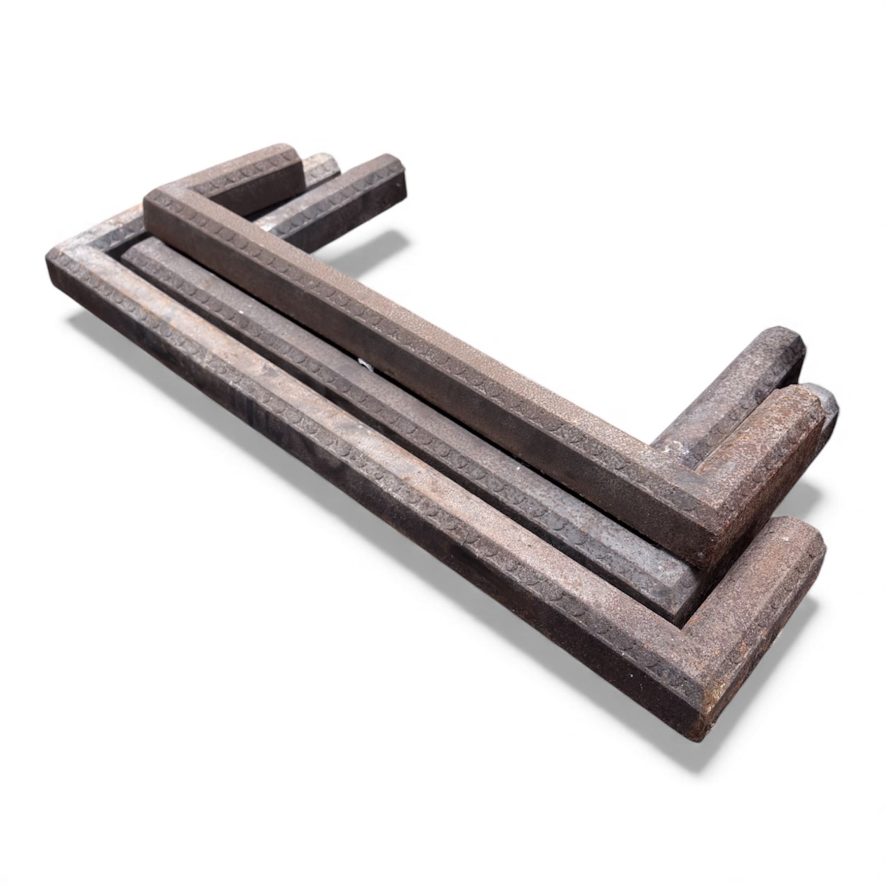 Two cast iron fire surrounds / inserts along with four metal surround pieces 